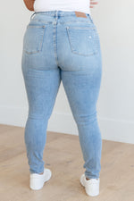 Load image into Gallery viewer, Eloise Mid Rise Control Top Distressed Skinny Jeans
