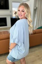 Load image into Gallery viewer, Airflow Peplum Ruffle Sleeve Top in Chambray
