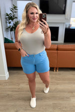 Load image into Gallery viewer, Celeste Mid Rise Shield Pocket Cutoff Shorts in Sky Blue

