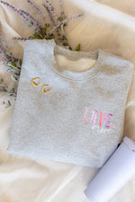 Load image into Gallery viewer, Love More Embroidered Sweatshirt
