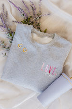 Load image into Gallery viewer, Love More Embroidered Sweatshirt
