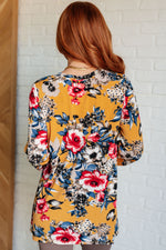 Load image into Gallery viewer, V-Neck Scoop Hem Top in Marigold Floral
