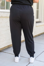 Load image into Gallery viewer, The Motive Slouch Joggers In Black
